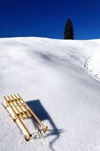 High angle view of sled on snowfield