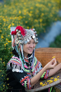 Rear view of woman sitting on plant