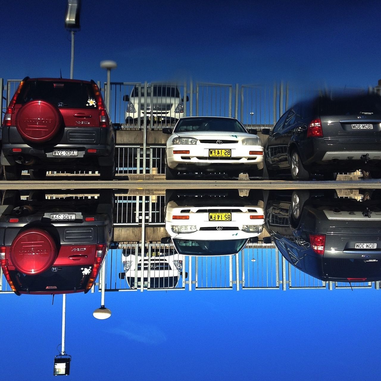 transportation, mode of transport, blue, car, land vehicle, clear sky, illuminated, road signal, guidance, travel, traffic, public transportation, city, building exterior, red, night, street light, architecture, built structure, street