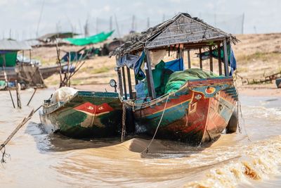 Fishing boats moored on beach