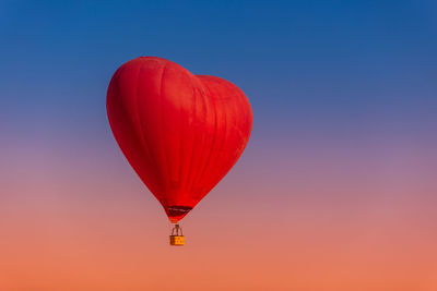 Low angle view of hot air balloons against clear sky