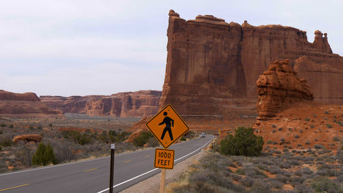 Road sign on rock formation