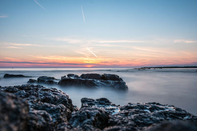 Scenic view of sea against sky during sunset