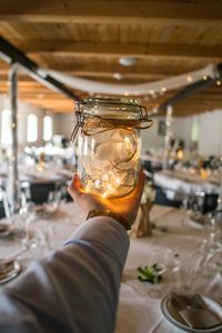 Close-up of hand holding wine glass