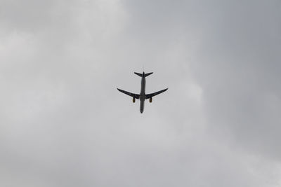 Low angle view of airplane against sky