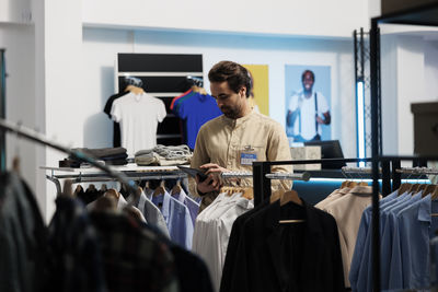 Rear view of woman standing in store