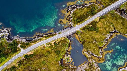 High angle view of road amidst sea