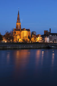 Illuminated city at waterfront