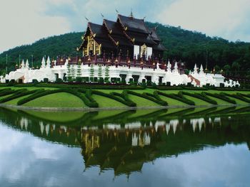 Royal pavilion reflecting in lake at chiang mai province