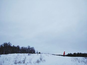 Woman on snow covered landscape