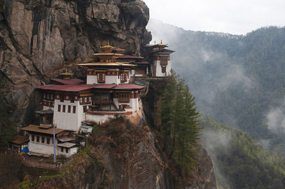 Panoramic view of buildings against mountains