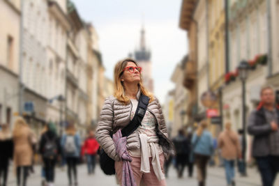 Mature woman standing in city