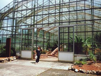 Full length of man standing by building