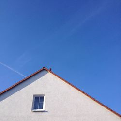 Low angle view of building against blue sky