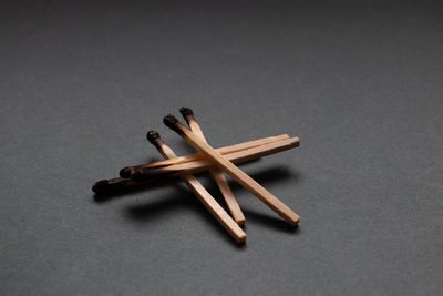 High angle view of wood on table against gray background