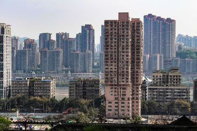 Modern buildings in city against sky