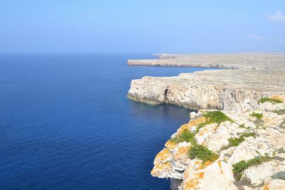 Scenic view of sea against blue sky