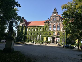 Street by building against sky