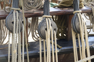 Ropes tied to pulley in ship