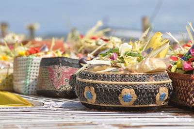 Close-up of flowers in basket on table