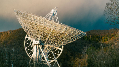 Radio telescope effelsberg by mountains against sky