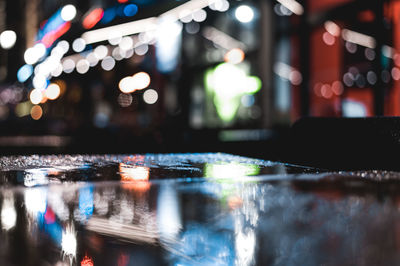 Close-up of wet table at night