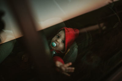 Portrait of baby girl relaxing in car 