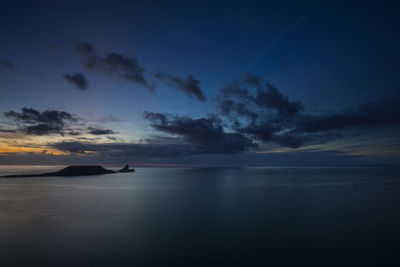 Scenic view of sea against sky at sunset