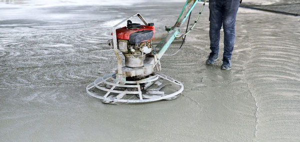 Low section of person making flooring