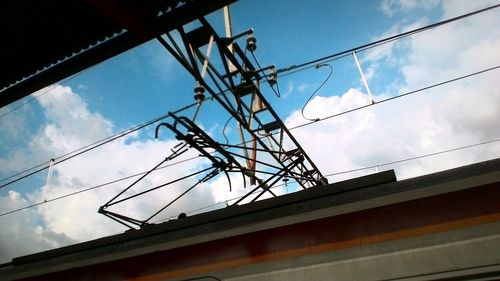 Low angle view of cables against sky