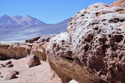 Scenic view of mountains against clear blue sky