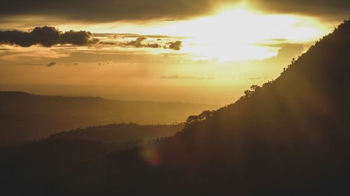 Scenic view of silhouette mountain against sky during sunset
