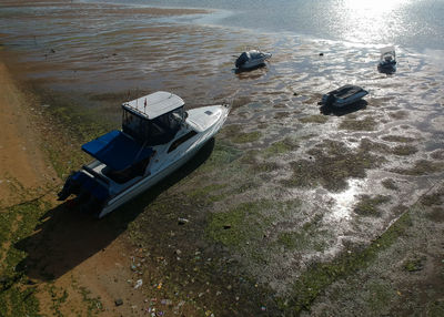 High angle view of boats moored on shore