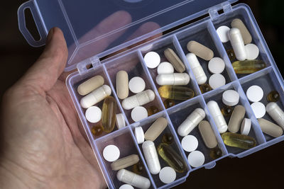 High angle view of human hand holding objects