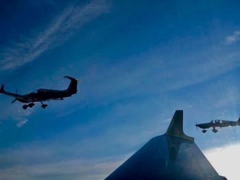 Low angle view of airplane flying in sky