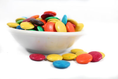 Close-up of multi colored candies on table