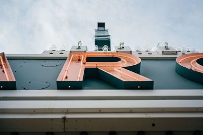 Ship moored on pier against sky