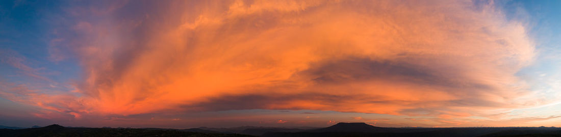 Low angle view of dramatic sky during sunset