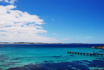 Scenic view of sea against blue sky