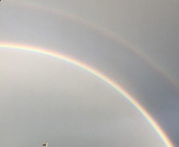 Low angle view of rainbow against sky