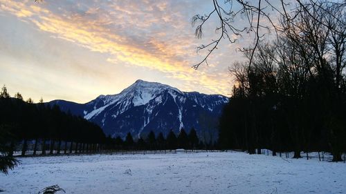 Scenic view of mountains against sky during winter