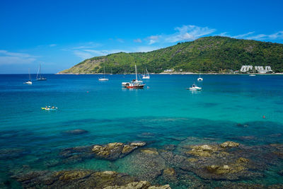 Scenic view of sailboat in sea against sky