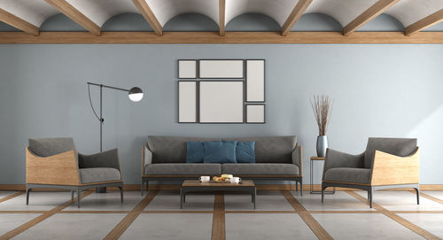 Blue modern living room with sofa , armchairs and cement and wooden floor - 3d rendering