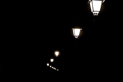 Low angle view of illuminated street light at night