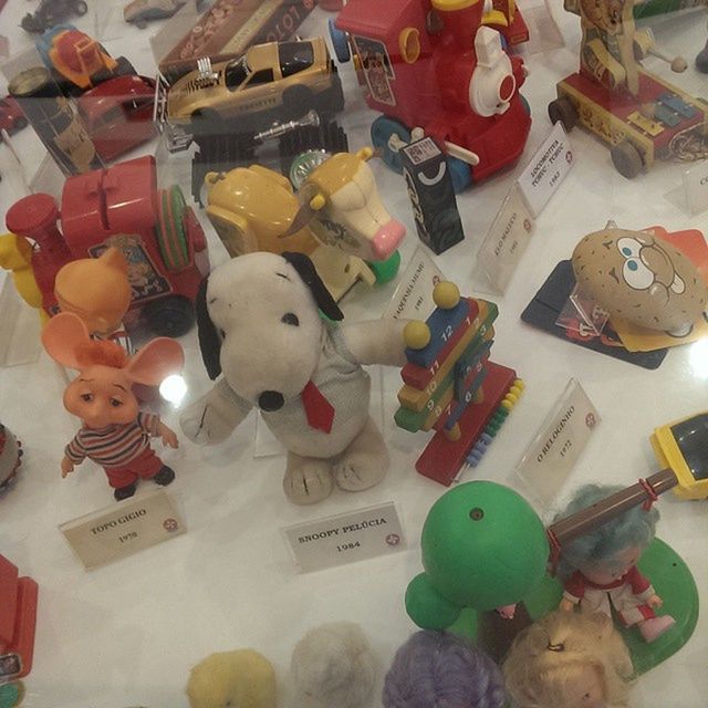 indoors, toy, art, art and craft, human representation, creativity, multi colored, variation, animal representation, still life, large group of objects, choice, decoration, childhood, celebration, high angle view, stuffed toy, table