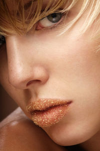 Close-up portrait of woman wearing lipstick
