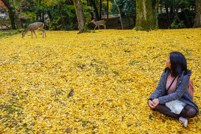 Woman sitting on field