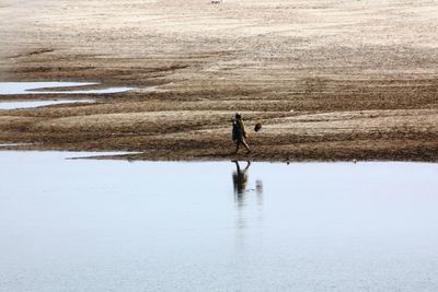 Person walking at beach