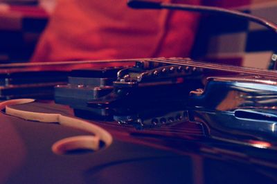 Close-up of man playing guitar