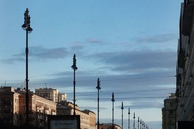 Street light against buildings in city